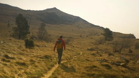 Hiker Walking Up the Hill Stock Footage