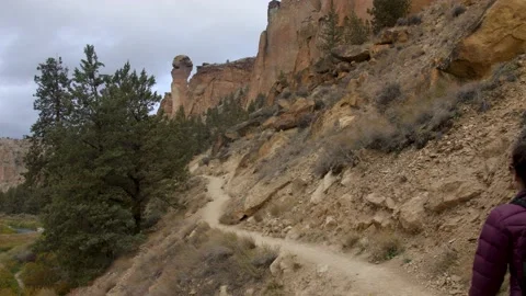 Hiker walking to Monkey Face Rock at Smith Rock State Park Stock Footage 132660519