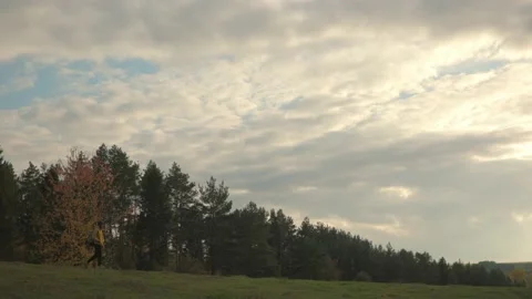 A hiker walking in nature carrying backpack. Stock Footage 220188974
