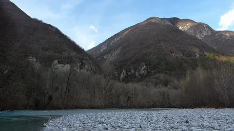 Hiker walking on the riverside. Man about 60 years old. Stock Footage 105033811