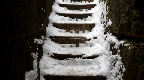 Hiker walking up Snow on Steps Stock-Footage 1001503
