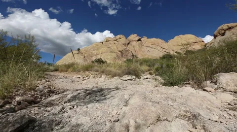 Hiker Walks Up a Path on a Mountain Stock Footage 57755013
