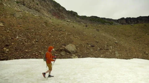 Hiker walks on snow Stock Footage 59521776