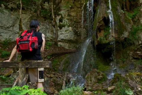 Hiker at a waterfall Fotos Stock