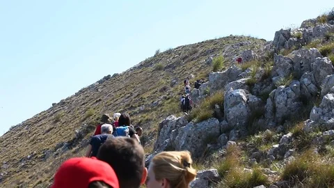 Hikers approaching mountain peak Stock Footage 79799325