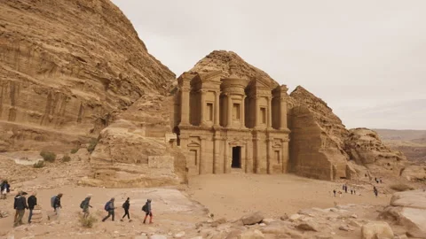 Hikers arriving at Monastery (Ad Deir) in Petra - Seven Wonders - World Heritage Stock Footage 250544824