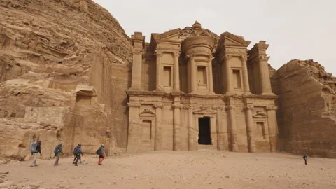 Hikers arriving at Monastery (Ad Deir) in Petra - Seven Wonders - World Heritage Stock Footage 250545677