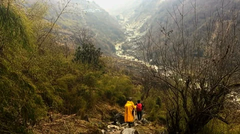 Hikers backpack mountain valley road river. Himalayas travel nature HD video Stock Footage 64828751