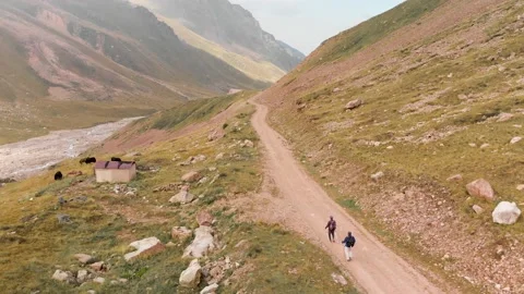 Hikers with backpack walking in the mountains Stock Footage 142622526