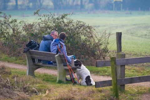 Hikers on a bench Stock Photos