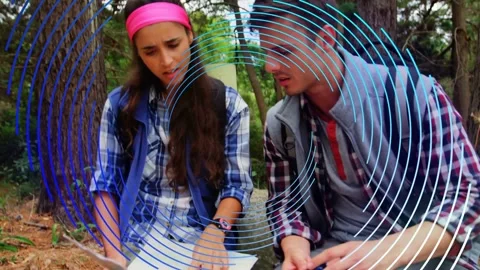 Hikers comparing map with GPS after GPS ping, matching path as blue overlay Stock Footage 334013777