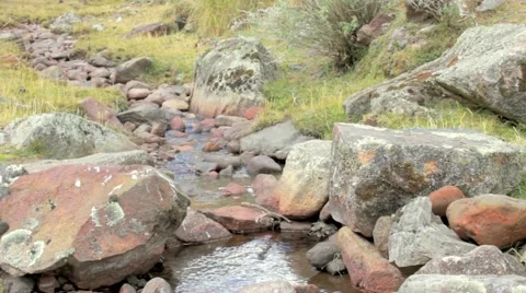Hikers crossing stream, Peru Stock Footage 62388911
