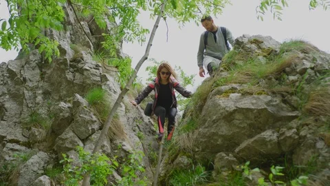 Hikers descending a mountain Stock Footage 99962655