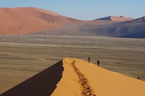 Hikers on the dunes, Namibia Stock Photos