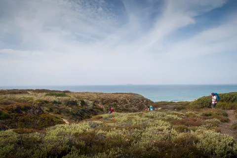Hikers in the dunes Stock Photos