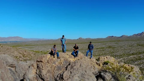Hikers Enjoy View On Top Fly Toward Aerial Stock Footage 112896880