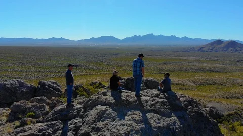 Hikers Enjoy View On Top Pull Back Aerial Stock Footage 112896925