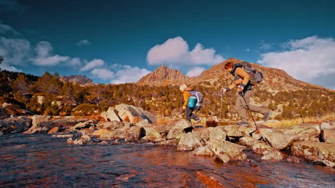 Hikers exploring the Pyrenees mountains in Spain during a sunny day Stock Footage 303626906