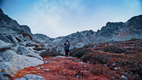 Hikers exploring the rugged terrain of the Pyrenees in Spain Stock Footage 303635867