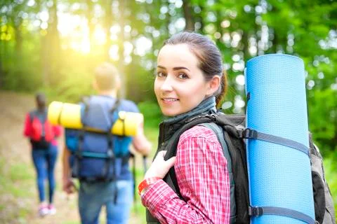 Hikers in forest. Stock Photos