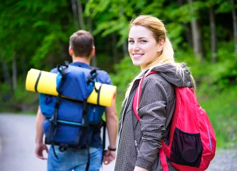 Hikers in forest. Stock Photos