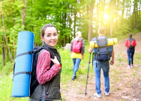 Hikers in forest. Stock Photos