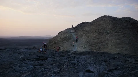 Hikers going down after reaching the crater of Dallol volcano in Ethiopia. Stock Footage 121181165