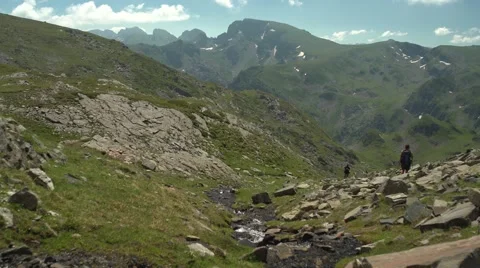  Hikers Going Down the Mountain River 4K Handheld Stock Footage 65302098