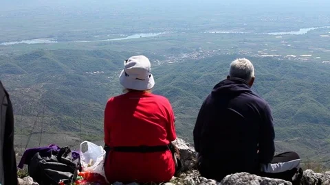 Hikers having a break with valley view Stock Footage 79800808
