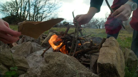 Hikers make campfire in evening Stock Footage 242606445