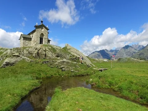 Hikers in mountain - River and meadows in mountain Stock Footage 77707323