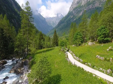 Hikers on path in mountain - Val di Mello Video stock 77651070