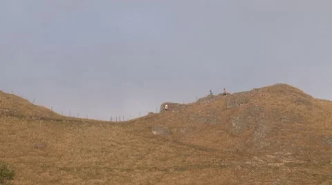 Hikers on a ridge line Stock Footage 8693759