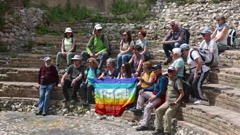 Hikers seated at ancient Odeon steps in Taormina Stock Footage 311164789