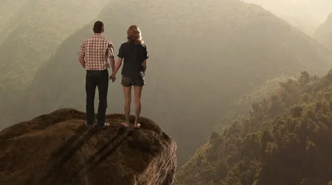Hikers standing on rock ledge. Stock Footage 43681461