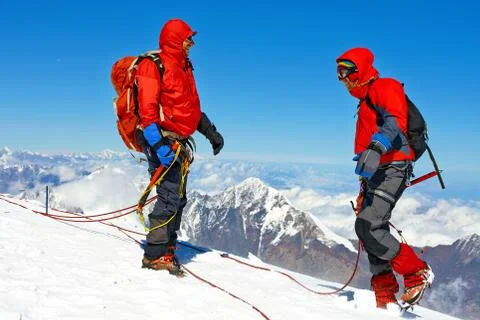 Hikers at the top of a pass Stock Photos