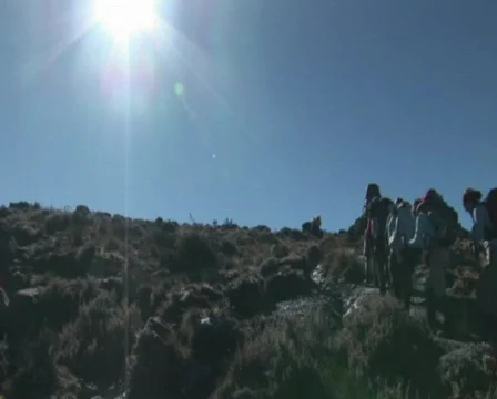 Hikers uphill in sun Stock Footage 606971