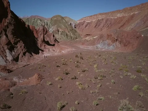 Hikers in Valle de Arco Iris aerial in Chile Stock Footage 83296199