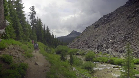Hikers walk in the distance Stock Footage 59082716