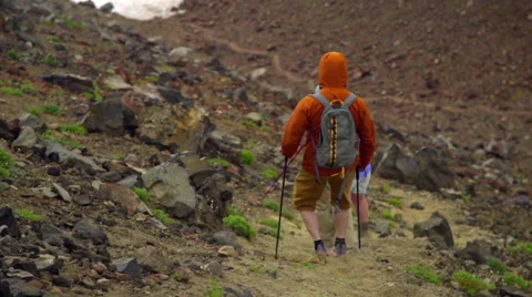 Hikers walk down steep mountain trail Stock Footage 59520347