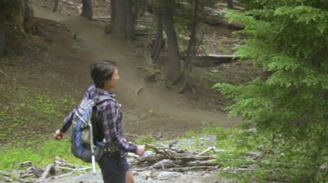 Hikers walk downhill on path Stock Footage 59083827
