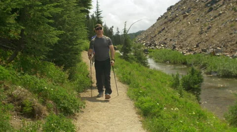 Hikers walk past camera Stock Footage 58954290