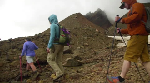 Hikers walk on rocks Stock Footage 59567651