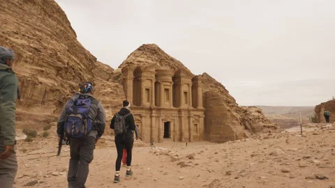 Hikers walking Back Trail to Monastery (Ad Deir) in Petra Stock Footage 250545089