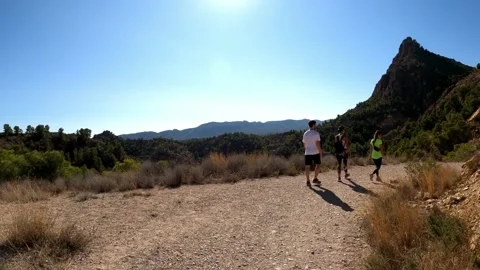 Hikers walking in group at mountain forests and pathways Vídeos de archivo 142593773
