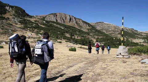 Hikers walking on a mountain trail Stock Footage 40254632