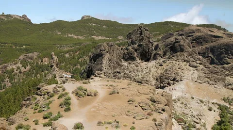 Hikers walking to Roque Nublo Stock Footage 6978596