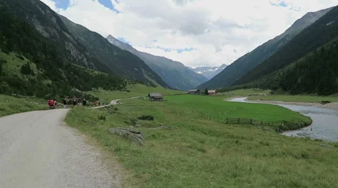 Hiking along the path through Achental valley at Krimml Waterfalls Vídeo Stock 67890776