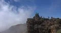Hiking and heavenly clouds on rocky mountain peak in La Palma island Photo