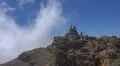 Hiking and heavenly clouds on rocky mountain peak in La Palma island Photo